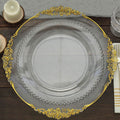 Elegant clear glass plate with gold trim and beaded detail.