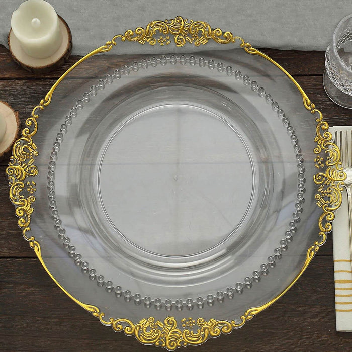 Elegant clear glass plate with gold trim and beaded detail.
