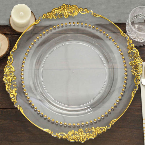 Elegant clear glass plate with gold embellishments and beaded rim.