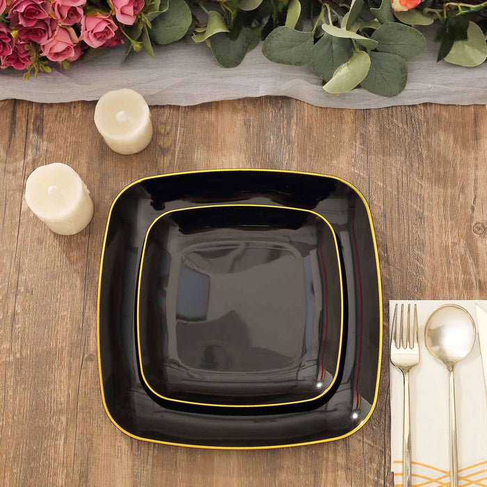 Elegant black square plates with yellow trim on a wooden table setting.