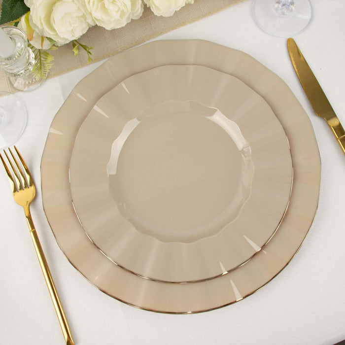 Elegant beige dinnerware set with scalloped edges and gold trim.