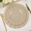 Elegant beige dinnerware set with scalloped edges and gold trim.