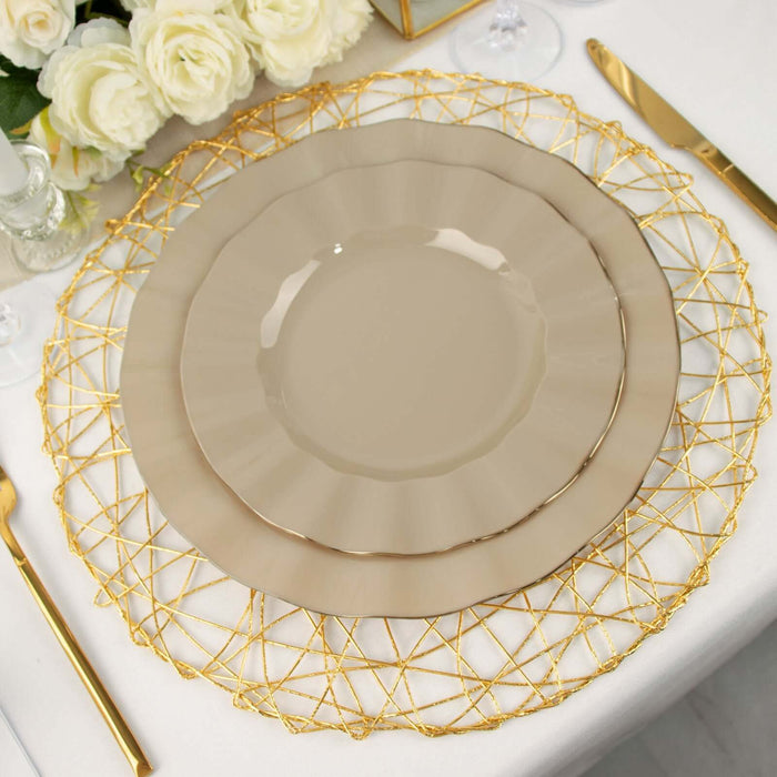 Elegant beige dinner plate set on a decorative gold charger with floral backdrop.