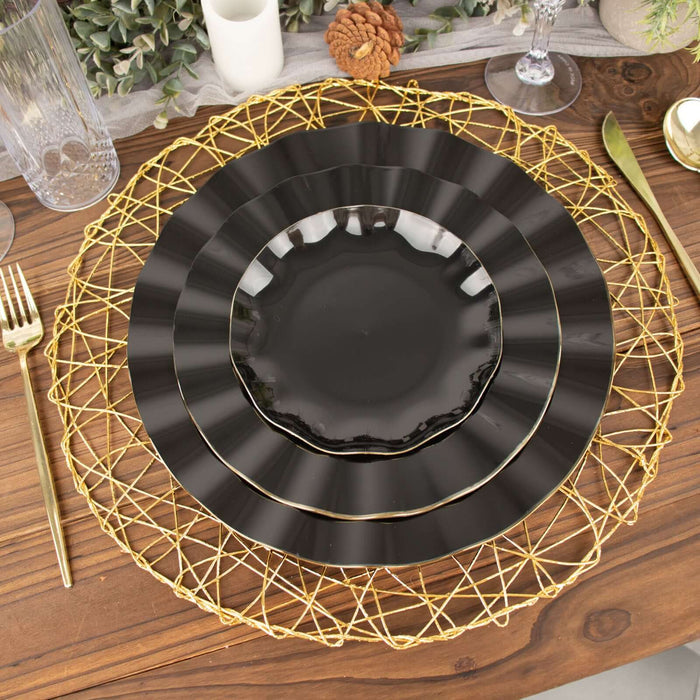 Elegant black plates on a decorative woven charger for dining table setting.