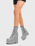 Illusionistic
  
  Aftershock Chunky Platform Ankle Boots in Black and White faux leather. These platform boots feature a black and white check design with a platformed wedge. Made with eco-friendly materials and 100% cruelty-free, these platform boots are as ethical as they are chic.
  
  - Platform Height
  - Fitted feel
  - Black and White check
  - Rounded toe
  - High Heel
  - 100% vegan 
  
  SKU: LMF 3536 - Black White