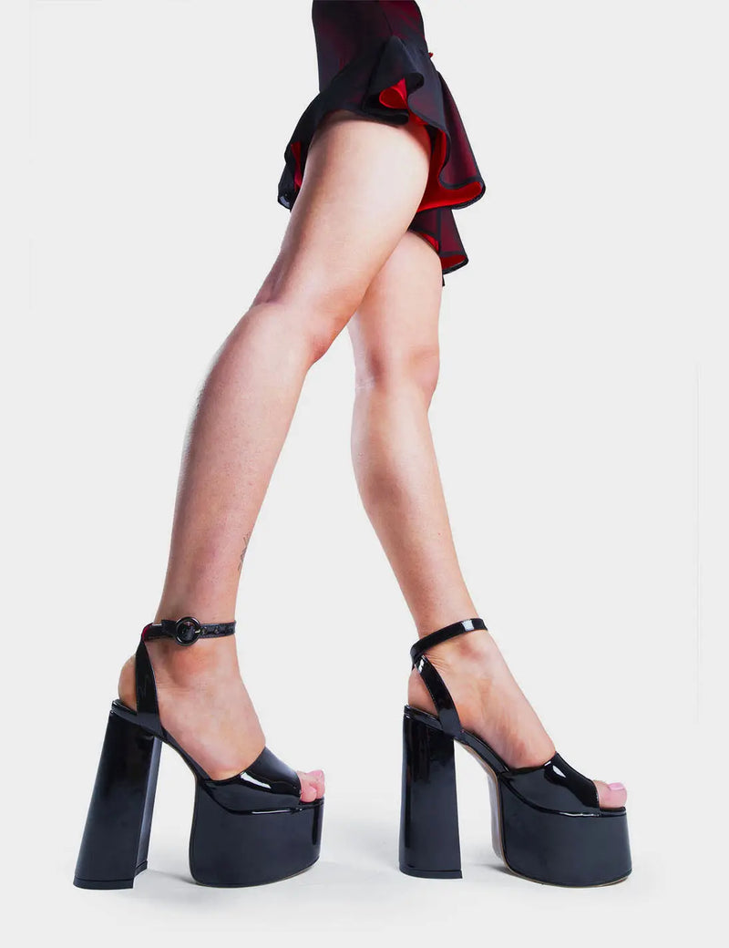 MAKE YOUR STATEMENT 
  
  All For You Platform Sandals in Black Patent. These high heeled vegan Sandals feature an adjustable ankle strap with a Platform sole and high heel, perfect for adding height and glamour to any outfit. Made with eco-friendly materials and 100% cruelty-free.
  
  
  - Platform Height: 2.5 inch
  - Heel Height: 5.5 inch 
  - Open Toe
  - Wrap around ankle strap
  - O shaped buckle and silver eyelets
  - Platform sole
  - Round toe 
  - 100% vegan 
  
  SKU: LMS 104 BLACKPAT