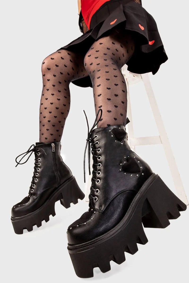 Perfect Pairing
  
  All I Need Chunky Platform Ankle Boots in black faux leather. These black vegan Platform Boots feature lace up detail and three black suede hearts with a perimeter of silver studs, complete your look with theese cuties. Made with eco-friendly materials and 100% cruelty-free.
  
  
  - Platform Height: 3.3 inch
  - Black zipper
  - Lace up detail with silver eyelets
  - Black suede hearts
  - Silver studs 
  - Chunky platform sole
  - Round Toe
  - 100% vegan