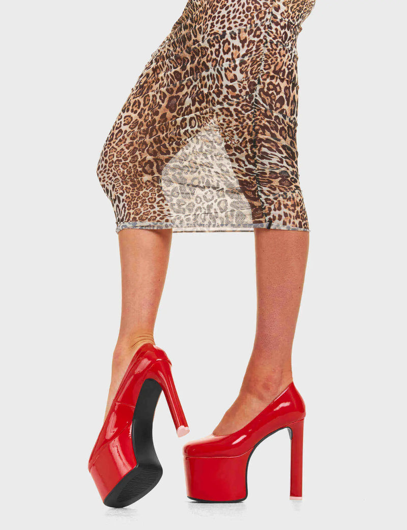PARTY ALL NIGHT 
  
  Baddy Platform Heels Red Pat in Red patent. These platform boots feature a minimalist look with a heart shaped high heel, keeping it nice and classy.These heels also feature a pink heart on the heel. Made with eco-friendly materials and 100% cruelty-free, these platform boots are as ethical as they are chic.
  
  - Platform Height
  - Heart shaped heel
  - Silver Buckle
  - Silver Eyelets
  - High heel
  - Round toe
  - High Heel
  - 100% vegan
  
  SKU: LMF 4623 - RedPAT