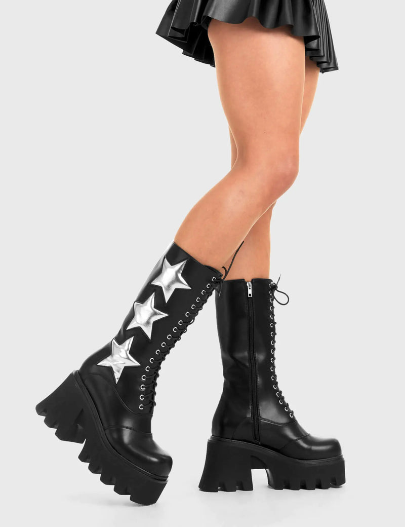STARRY NIGHT
  
  Big League Chunky Platform Calf Boots in Black faux leather. These vegan western Boots feature a black lace up boot with silver stars , very classy. Made with eco-friendly materials and 100% cruelty-free, these boots are as ethical as they are edgy!
  
  
  - Chunky Platform
  - Calf length
  - Lace up
  - Silver stars
  - Rounded toe 
  - 100% vegan 
  
  SKU: LMF 3607 - BlackPU/SilverStar