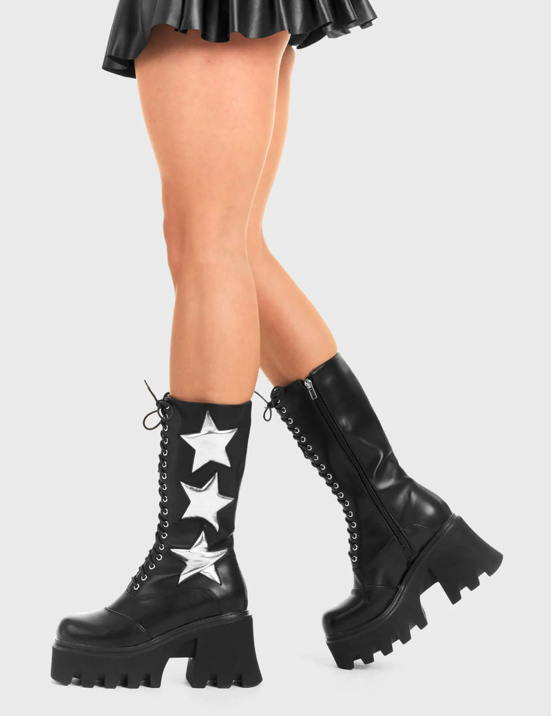 STARRY NIGHT
  
  Big League Chunky Platform Calf Boots in Black faux leather. These vegan western Boots feature a black lace up boot with silver stars , very classy. Made with eco-friendly materials and 100% cruelty-free, these boots are as ethical as they are edgy!
  
  
  - Chunky Platform
  - Calf length
  - Lace up
  - Silver stars
  - Rounded toe 
  - 100% vegan 
  
  SKU: LMF 3607 - BlackPU/SilverStar
