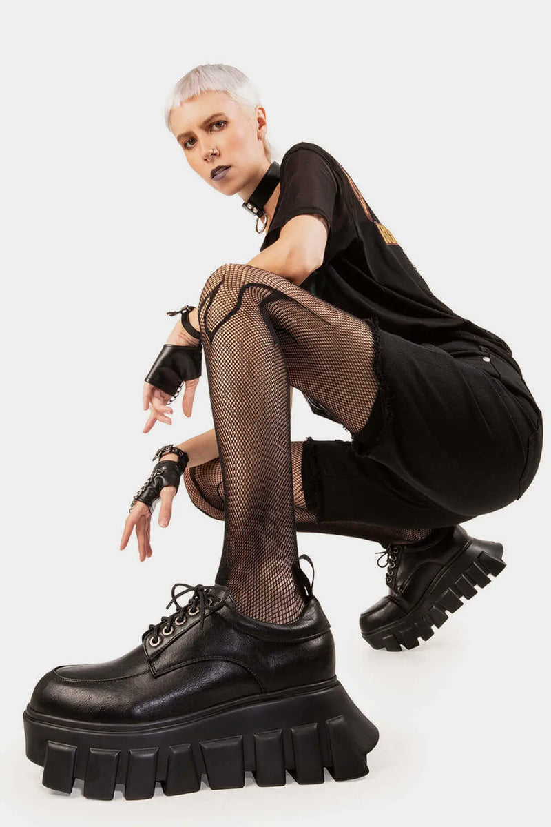 Edgy Explorers
  
  Black Hole Chunky Platform Sneakers in Black faux leather. These Black vegan Platform sneakers feature our chunky sole, platform sneakers that speak volumes step by step. Made with eco-friendly materials and 100% cruelty-free, these Chunky Sneakers are as ethical as they are unmatched!
  
  
  - Platform Height: 1.6 inch
  - Black laces
  - Silver eyelets
  - Chunky sole
  - Round Toe
  - 100% vegan 
  
  SKU: LMF 1033 - BlackPU