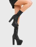TIME TO PARTY
  
  Bling Platform Ankle Boots in Black Glitter. These vegan western Boots feature a glittery look, perfect for a night out. Made with eco-friendly materials and 100% cruelty-free, these boots are as ethical as they are Eye-Catching!
  
  
  - Platformed high heel
  - Calf length
  - Black Glitter
  - Shark teeth Grip
  - Rounded toe 
  - 100% vegan 
  
  SKU: LMF 3819 - BlackGlitter