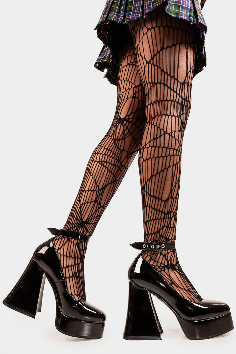 Elevated Elegance.
  
  Build Me Up Platform Heels in Black Patent faux leather. These vegan Platform Heels feature a adjustable black patent ankle strap with a "O" ring buckle and silver eyelets, stepping into sophistication. Made with eco-friendly materials and 100% cruelty-free.
  
  - Platform Height: 2.6 inch
  - Heel Height: 5.5 inch
  - Adjustable black patent strap
  - Silver eyelets 
  - "O" ring buckle
  - Platform sole
  - Flared heel
  - Round toe
  - 100% vegan
  
  SKU: LMF 1707 - BlackPAT