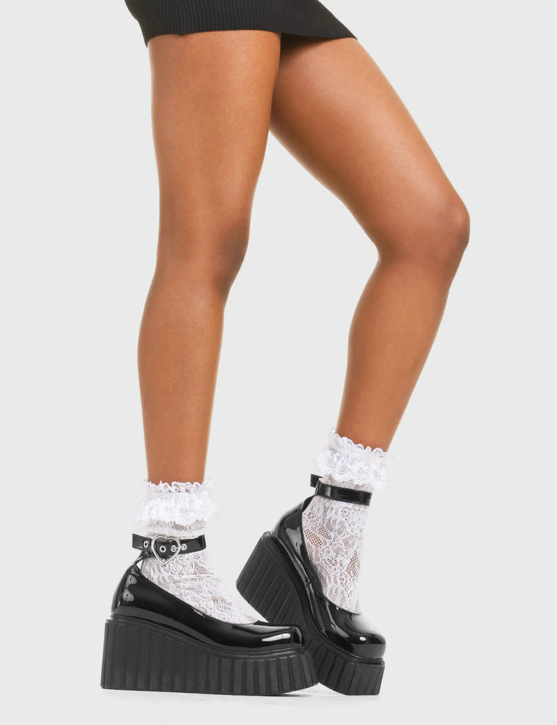 STRAPPED IN
  
  Cant Stop Chunky Platform Creeper Shoes in Black patent. These vegan western Boots feature a minimalist design with a silver heart buckle, very classy. Made with eco-friendly materials and 100% cruelty-free, these boots are as ethical as they are edgy!
  
  
  - Chunky Platform
  - Ankle length
  - Adjustable straps
  - Silver heart buckles
  - Rounded toe 
  - 100% vegan 
  
  SKU: LMF 3609 - BlackPAT