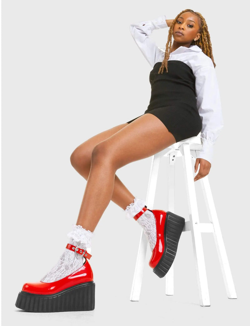 STRAPPED IN
  
  Cant Stop Chunky Platform Creeper Shoes in Red patent. These vegan western Boots feature a minimalist design with a silver heart buckle, very classy. Made with eco-friendly materials and 100% cruelty-free, these boots are as ethical as they are edgy!
  
  
  - Chunky Platform
  - Ankle length
  - Adjustable straps
  - Silver heart buckles
  - Rounded toe 
  - 100% vegan 
  
  SKU: LMF 3609 - RedPAT