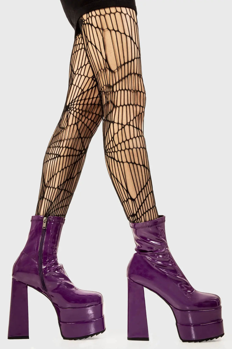 Runway Ready
  
  Cassette Platform Ankle Boots in Purple Patent faux leather. These purple vegan Platform boots feature on our double stack platform sole, sleek and stylish to own your runway! Made with eco-friendly materials and 100% cruelty-free, these platform boots are as ethical as they are runway worthy!
  
  
  - Platform Height
  - Heel Height
  - Purple Zipper 
  - Shark's teeth rubber grip 
  - Chunky platform sole
  - Square Toe
  - 100% vegan 
  
  SKU: LMF 2141 - PurplePAT