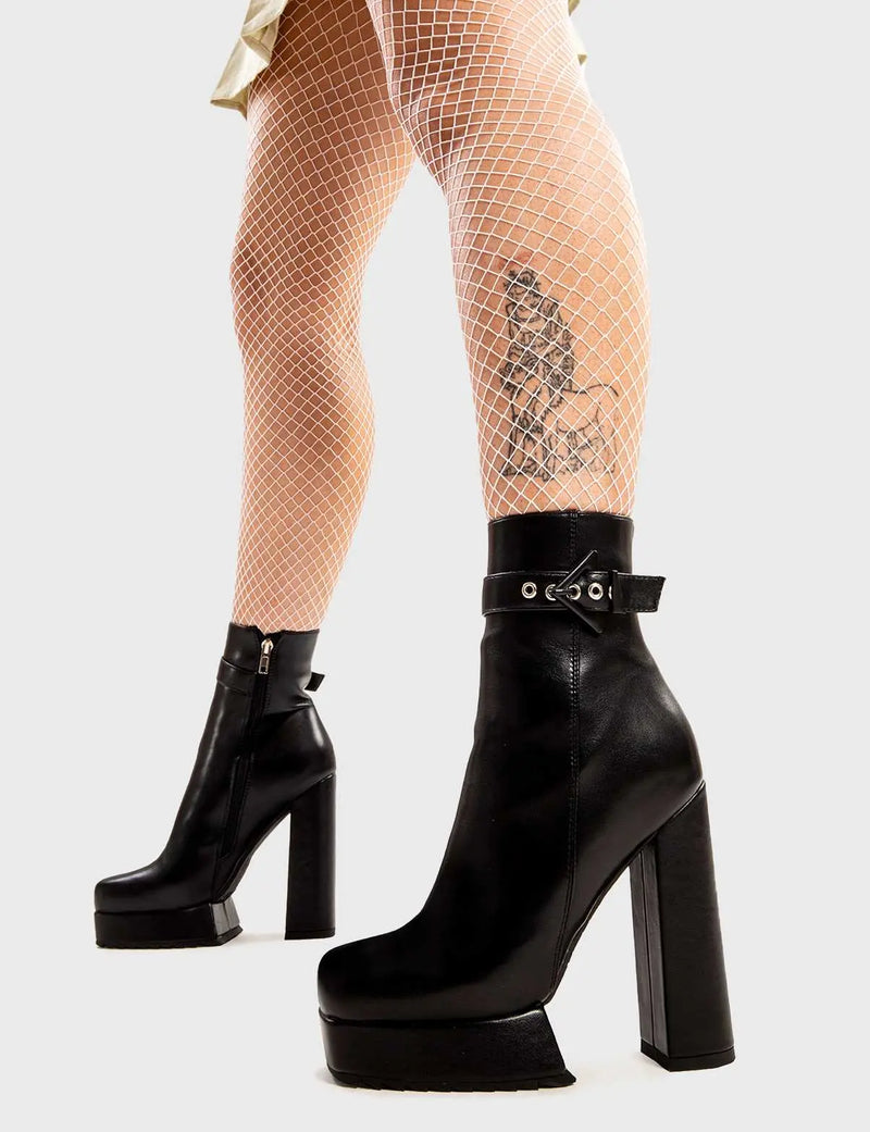 Not Your Basic Boots

Check In Platform Ankle Boots in Black faux leather. These boots feature a minimalist design with a thin ankle strap and a Black Triangle buckle, the perfect boots with any outfit. Made with eco-friendly materials and 100% cruelty-free, these platform boots are as ethical as they are Iconic!

- Platform Height
- Heel Height
- Ankle strap
- Black Triangle Buckle and Silver Eyelets
- Black Zip 
- Ankle length
- Shark's teeth grip
- Platform sole
- 100% vegan 

SKU: LMF 2834 - BlackPU