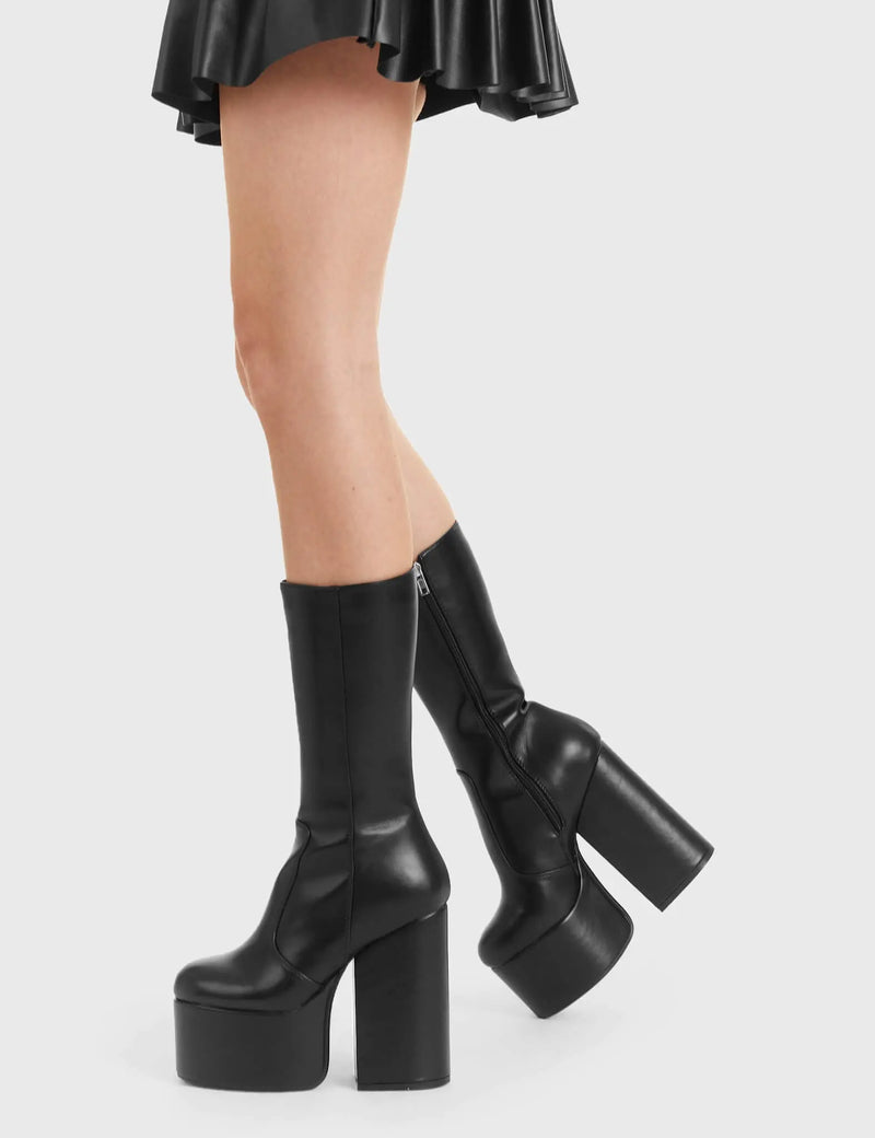 Not Your Basic Boots
  
  Circle Of Lies Platform Calf Boots in Black faux leather. These platform boots feature a minimalist design on platform sole, perfect boots to compliment any outfit. Made with eco-friendly materials and 100% cruelty-free, these platform boots are as ethical as they are trendy.
  
  - Platform Height
  - Heel Height
  - Black zip
  - Thick High Heel
  - Platform sole
  - 100% vegan 
  
  SKU: LMF 3004 - BlackPU