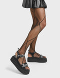 BELIEVE

Convincing Chunky Platform Creeper Sandals in Black faux leather. These creeper sandals feature a strap design, including a adjustable strap across the ankle, with silver eyelets and a square shaped buckle. Also incldues a aesthetic sliver chain. Made with eco-friendly materials and 100% cruelty-free, these sandals are as ethical as they are edgy

- Platform Height
- Silver Eyelets
- Square Shaped Buckles
- Silver Chain
- Platform Creeper Sole
- Open Toe
- 100% vegan

SKU: LMF 4407 - BlackPU