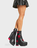 DARK LOVE
  
  Copacetic Chunky Platform Ankle Boots in Black faux leather. These platform boots feature big dark red hearts with a platformed wedge. Also features a red heart on the heel. Made with eco-friendly materials and 100% cruelty-free, these platform boots are as ethical as they are chic.
  
  - Platform Height
  - Ankle Length
  - Dark Red hearts
  - Rounded Toe
  - High Heel
  - 100% Vegan
  
  SKU: LMF 5237 - BlackPU/DarkRed