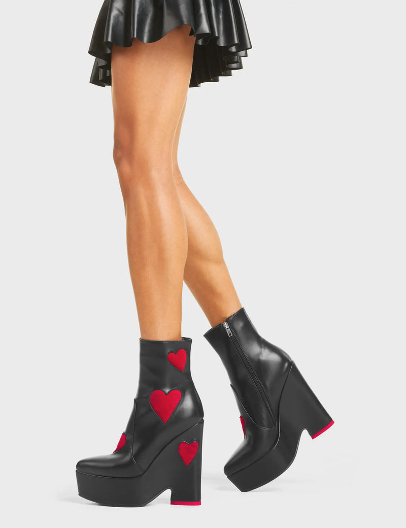 DARK LOVE
  
  Copacetic Chunky Platform Ankle Boots in Black faux leather. These platform boots feature big dark red hearts with a platformed wedge. Also features a red heart on the heel. Made with eco-friendly materials and 100% cruelty-free, these platform boots are as ethical as they are chic.
  
  - Platform Height
  - Ankle Length
  - Dark Red hearts
  - Rounded Toe
  - High Heel
  - 100% Vegan
  
  SKU: LMF 5237 - BlackPU/DarkRed