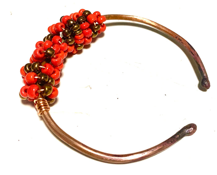 Multi colored red orange and tan beads soft copper band for easy opening  adjustments ball ends