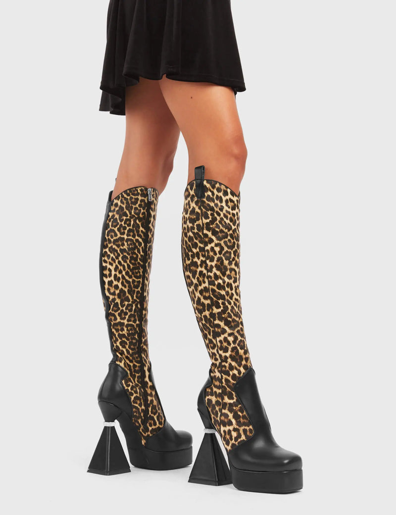 UNFORGETTABLE
  
  Curious Platform Knee High Boots in black and leopard faux leather. These platform boots feature a chic look with a flared heel that includes silver ring detailing on the heel, keeping it nice and classy. These heels also feature a functional zip on the leopard detailed upper. Made with 100% vegan materials. 
  
  - Platform Height
  - Leopard Design
  - Functional Zip
  - Flared Heel
  - Silver Ring Detail
  - Round Toe
  - 100% vegan
  
  SKU: LMF 5442 - BlackPU/Leo