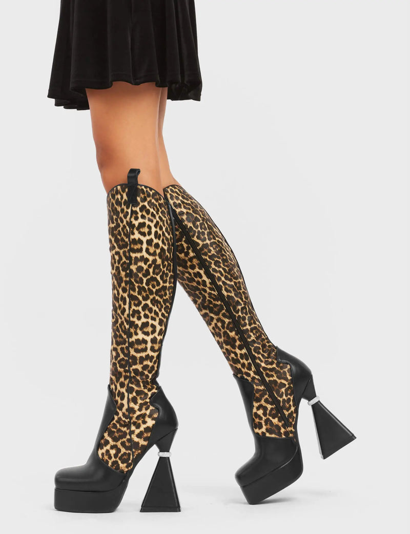 UNFORGETTABLE
  
  Curious Platform Knee High Boots in black and leopard faux leather. These platform boots feature a chic look with a flared heel that includes silver ring detailing on the heel, keeping it nice and classy. These heels also feature a functional zip on the leopard detailed upper. Made with 100% vegan materials. 
  
  - Platform Height
  - Leopard Design
  - Functional Zip
  - Flared Heel
  - Silver Ring Detail
  - Round Toe
  - 100% vegan
  
  SKU: LMF 5442 - BlackPU/Leo