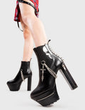 Boots to die for!
 
 Deathbed Platform Ankle Boots in Black faux leather. These platform boots feature a skull print on the gusset with zips on our platform sole and high heel, along with chains and spikes. Made with eco-friendly materials and 100% cruelty-free, these platform boots are as ethical as they are Edgy
 
 - Platform Height
 - Heel Height
 - Black zip
 - Skull print
 - Gusset
 - Chains
 - Zip detailing
 - Spikes
 - Platform Sole
 - Shark's Teeth Grip
 - 100% vegan 
 
 SKU: LMF 3121 - Black/Skull