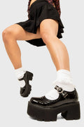 THE SHOEDROBE STAPLE
  
  Dedicated Chunky Mary Jane Shoes in Black Patent. These Mary Janes feature a brogue pattern and a Chunky and comfortable Platform sole. Everyone needs a pairs of Mary Janes! Made with eco-friendly materials and 100% cruelty-free, these Sandals are as ethical as they are cute!
  
  
  - Platform Height: 3 inch
  - Over the foot strap
  - O shaped buckle and silver eyelets
  - Chunky Platform sole
  - Round toe 
  - 100% vegan 
  
  SKU: LMS 400 - BlackPAT