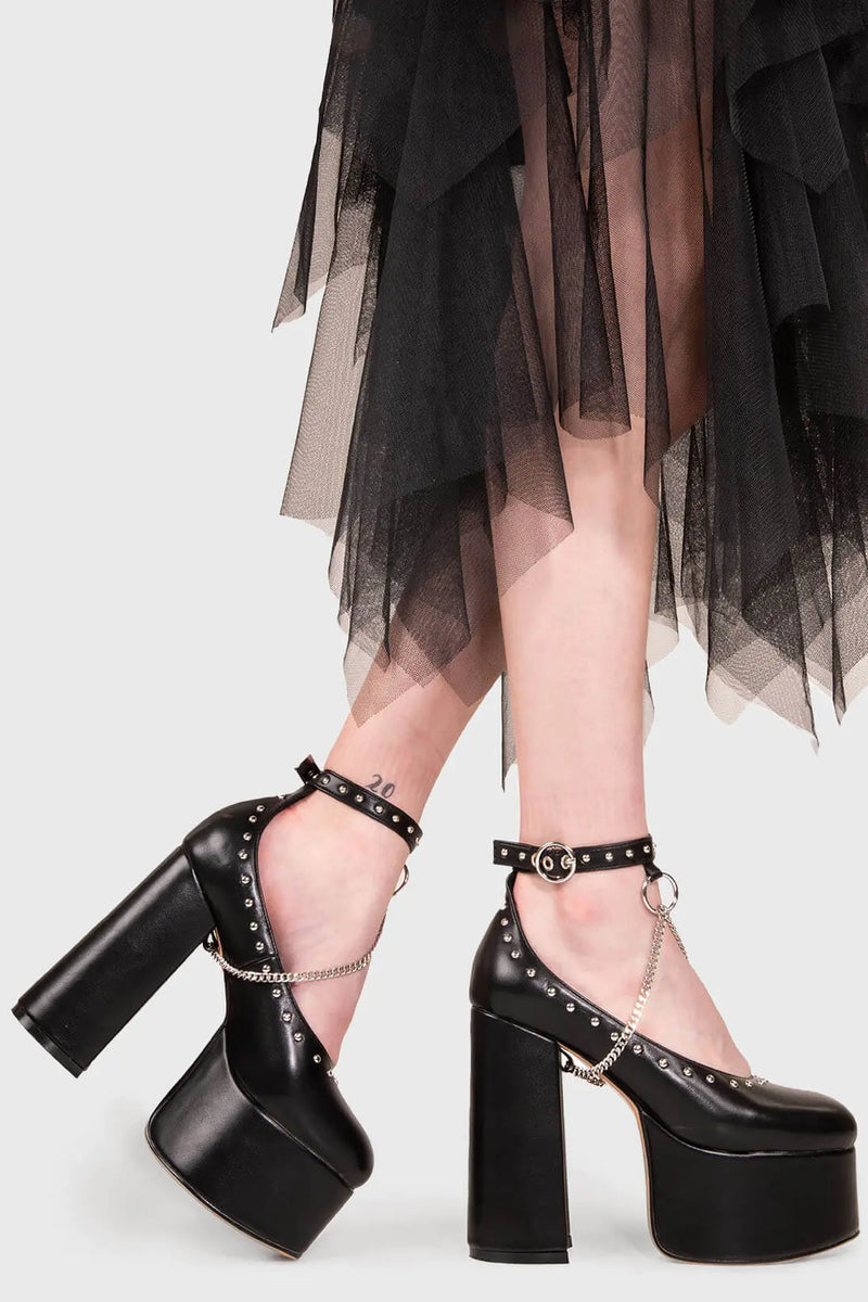 THE SHOEDROBE STAPLE
  
  Watch Me Chunky Mary Jane Shoes in Black faux leather. These Mary Janes feature a Chunky and comfortable Platform sole. Everyone needs a pairs of Mary Janes! Made with eco-friendly materials and 100% cruelty-free, these Sandals are as ethical as they are cute!
  
  
  - Platform Height: 3 inch
  - T Bar structure
  - Square buckle and silver eyelets
  - Chunky Platform sole
  - Round toe 
  - 100% vegan 
  
  SKU: LMS 194 - BlackPU