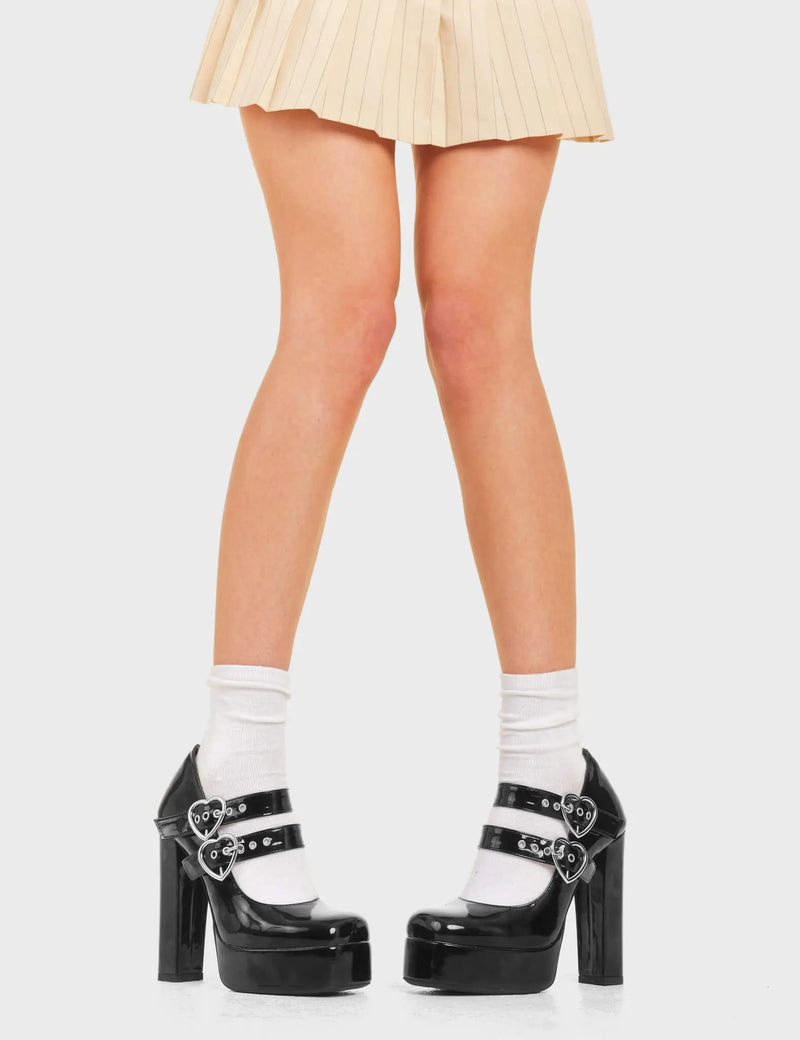 MIND BLOWING
  
  Do It Right Platform Heels Black Patent. These platform heels feature two adjustable ankle straps with silver buckles and eyelets. Made with eco-friendly materials and 100% cruelty-free, these platform boots are as ethical as they are chic.
  
  - Platform Height
  - Two adjustable strap
  - Silver buckles and Eyelets
  - High heel
  - Pointed toe
  - Block Heel
  - 100% vegan 
  
  SKU: LMF 3789 - BlackPAT
