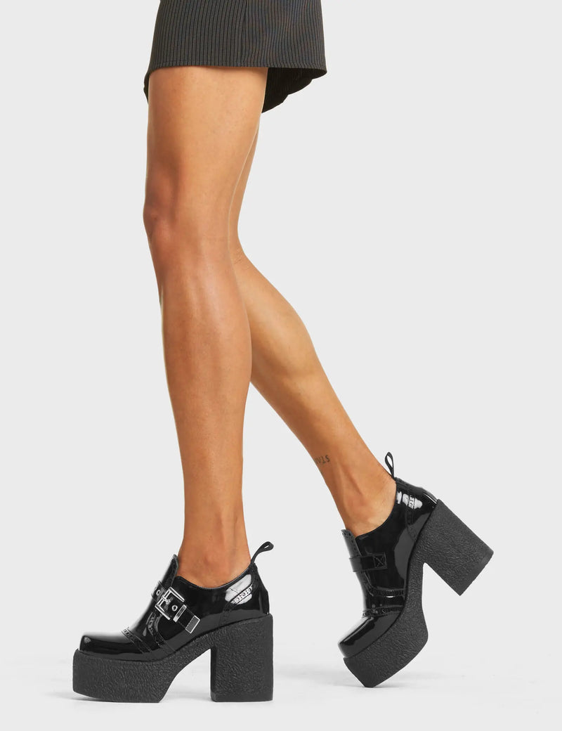 TOO BUSY
  
  Don't Call Chunky Platform Shoes, in Black Faux Leather. These vegan western Boots feature a brogued silhouette and a chunky platform sole, very classy. Also features a adjustable strap with a silver square shaped buckle. Made with eco-friendly materials and 100% cruelty-free, these boots are as ethical as they are edgy!
  
  
  - Chunky Platform
  - Brogued 
  - Sqaure Toe 
  - Adjustable Strap
  - Silver Buckle
  - Silver Eyelets
  - 100% vegan 
  
  SKU: LMF 4089 - BlackPAT