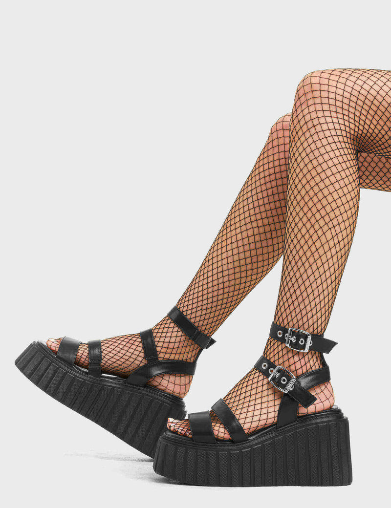AND ACTION!
 
 Dramatic Chunky Platform Creeper Sandals in Black faux leather. These creeper sandals feature a multiple strap cut out design, including an adjustable strap with silver eyelets and a sqaure shaped buckle. Made with eco-friendly materials and 100% cruelty-free, these platform sandals are as ethical as they are Loving!
 
 - Platform Height
 - Multiple strap design
 - Silver eyelets 
 - Square Shaped buckle
 - Platform creeper sole
 - Round Toe
 - 100% vegan
 
 SKU: LMF 4519 - BlackPU