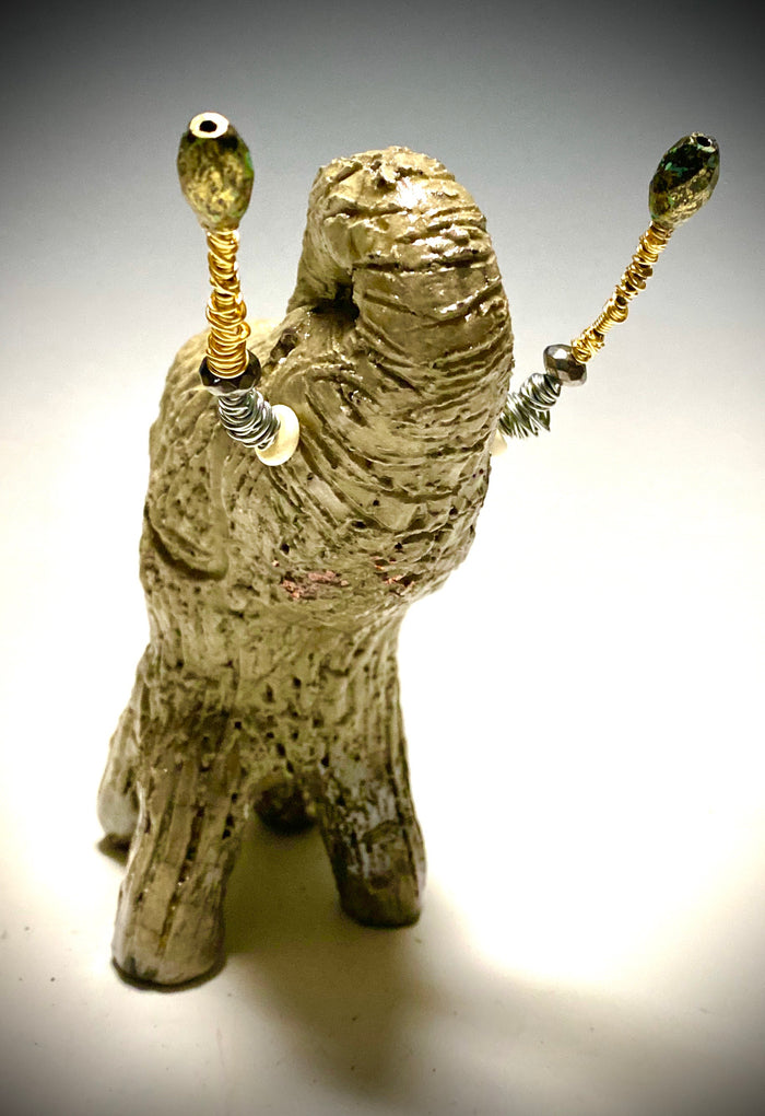 Raku Elephant Have you HERD!!!!!!  Just one of these lovely Raku Fired Elephant will make an excellent gift for your  friend, sorority or for your home’ special place centerpiece.   6" x 3" x 4" 1.3 lbs Beautiful metallic white raku elephant For decorative purposely only