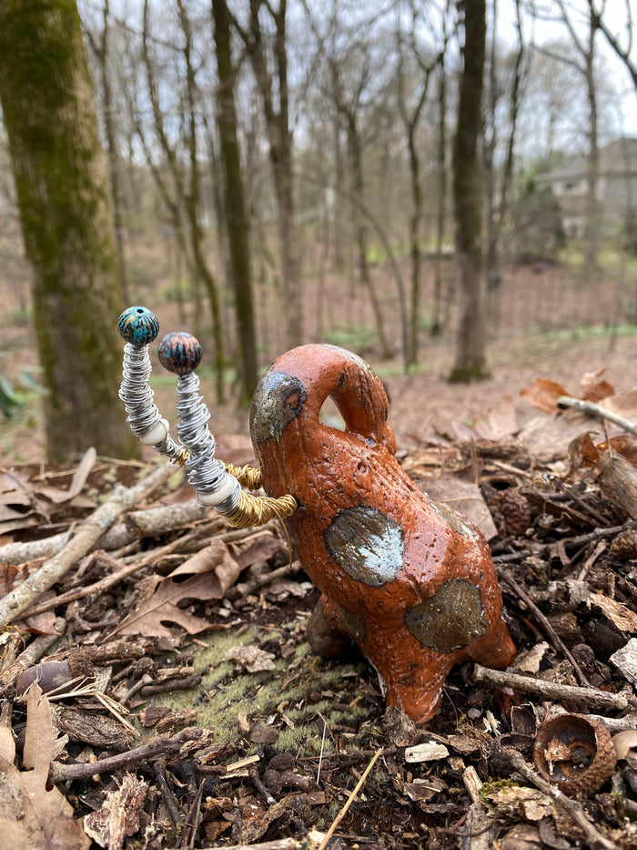 Raku Elephant Have you HERD!!!!!!  Just one of these lovely Raku Fired Elephant will make an excellent gift for your  friend, sorority or for your home’ special place centerpiece.  7" x 4" x 3" 11 ozs. Beautiful metallic gold and orange raku elephant For decorative purposely only.