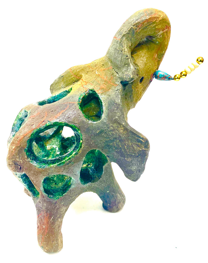 Raku Elephant Have you HERD!!!!!!  Just one of these lovely Raku Fired Elephant will make an excellent gift for your  friend, sorority or for your home’ special place centerpiece.   6" x 3" x 6" 1.4 lbs Beautiful metallic raku elephant with open body spaces. For decorative purposely only