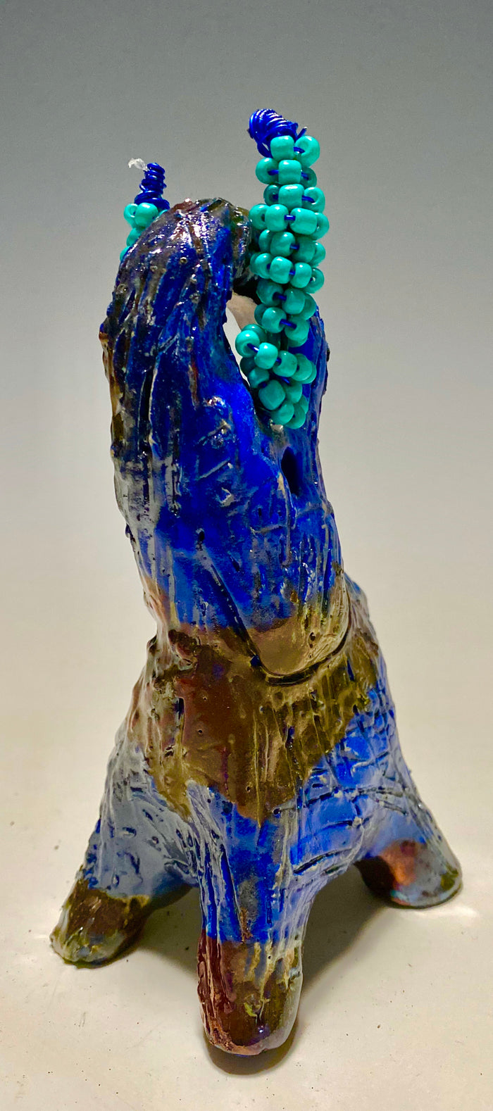 Raku Elephant Have you HERD!!!!!!  Just one of these lovely Raku Fired Elephant will make an excellent gift for your  friend, sorority or for your home’ special place centerpiece.   Beautiful copper blue rust raku elephant. 3.5" x 3" x 3" 12 ozs Beaded tribal tusk. For decorative purposely only
