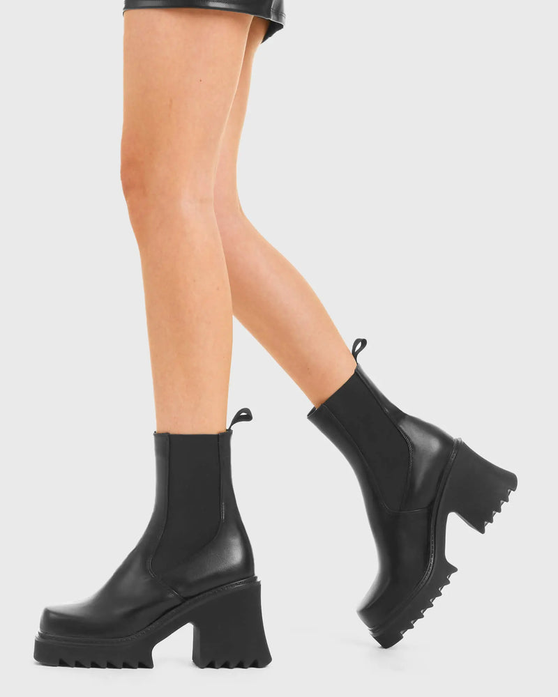 THESE BOOTS ARE MADE FOR WALKING
  
  Elevate Chunky Platform Ankle Boots in Black faux leather. These vegan western Boots feature a black gusset and a shark teeth grip sole, very chic. Made with eco-friendly materials and 100% cruelty-free, these boots are as ethical as they are edgy!
  
  
  - Chunky Platform
  - Calf length
  - Shark teeth grip
  - Black gusset
  - Rounded toe 
  - 100% vegan 
  
  SKU: LMF 3728 - BlackPU