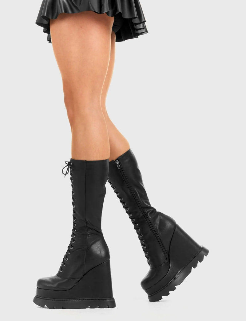 Not Your Basic Boots
  
  Empty Space Chunky Platform Calf Boots in Black faux leather. These Black vegan Wedge boots feature a lace-up design on our Platform wedge sole, perfect for adding height and edge to any look. Made with eco-friendly materials and 100% cruelty-free, these boots are as ethical as they are badass!
  
  
  - Platform Height: 
  - Heel Height
  - lace-up
  - Black Zip
  - Wedge sole
  - Round Toe
  - 100% vegan 
  
  SKU: LMF 2941 - BlackPU