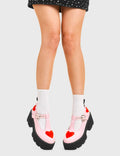 LOVABLE 
  
  Fairytale Chunky Mary Jane Shoes in Pink faux leather. These vegan western Boots feature red hearts complimenting the adjustable heart buckled straps, very cute. Made with eco-friendly materials and 100% cruelty-free, these boots are as ethical as they are romantic!
  
  
  - Platformed
  - Ankle length
  - Silver heart buckle
  - Red hearts
  - Chunky black sole
  - Rounded toe 
  - 100% vegan 
  
  SKU: LMF 3902 - PinkPU/RedHeart