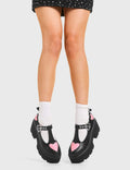 LOVABLE 
  
  Fairytale Chunky Mary Jane Shoes in Black faux leather. These vegan western Boots feature Pink hearts complimenting the adjustable heart buckled straps, very cute. Made with eco-friendly materials and 100% cruelty-free, these boots are as ethical as they are romantic!
  
  
  - Platformed
  - Ankle length
  - Silver heart buckle
  - Pink hearts
  - Chunky black sole
  - Rounded toe 
  - 100% vegan 
  
  SKU: LMF 3902 - BlackPU/PinkHeart