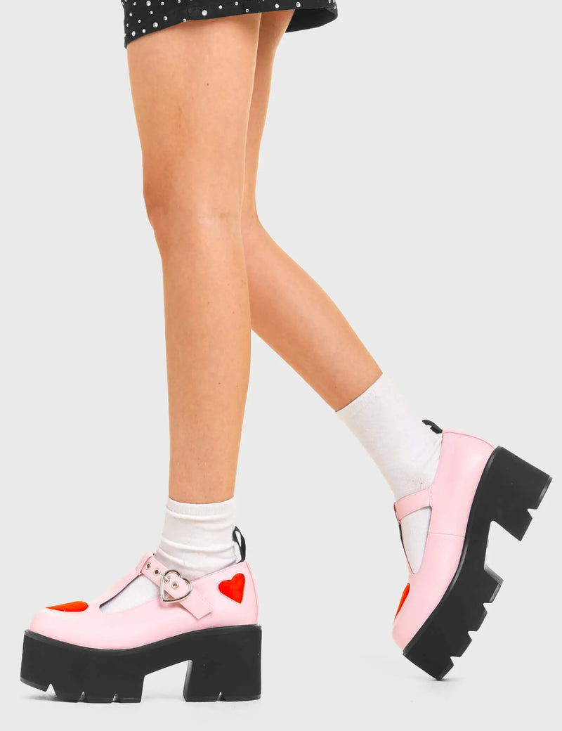 LOVABLE 
  
  Fairytale Chunky Mary Jane Shoes in Pink faux leather. These vegan western Boots feature red hearts complimenting the adjustable heart buckled straps, very cute. Made with eco-friendly materials and 100% cruelty-free, these boots are as ethical as they are romantic!
  
  
  - Platformed
  - Ankle length
  - Silver heart buckle
  - Red hearts
  - Chunky black sole
  - Rounded toe 
  - 100% vegan 
  
  SKU: LMF 3902 - PinkPU/RedHeart