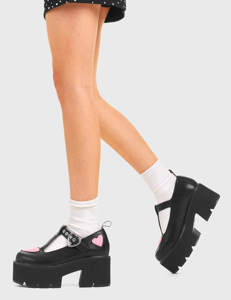 LOVABLE 
  
  Fairytale Chunky Mary Jane Shoes in Black faux leather. These vegan western Boots feature Pink hearts complimenting the adjustable heart buckled straps, very cute. Made with eco-friendly materials and 100% cruelty-free, these boots are as ethical as they are romantic!
  
  
  - Platformed
  - Ankle length
  - Silver heart buckle
  - Pink hearts
  - Chunky black sole
  - Rounded toe 
  - 100% vegan 
  
  SKU: LMF 3902 - BlackPU/PinkHeart