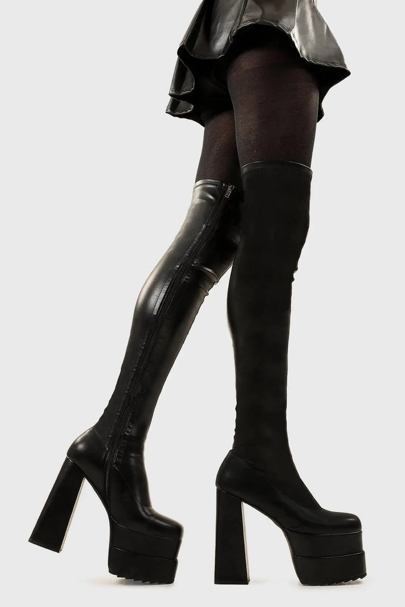 Ground Breaking
  
  Fantasies Platform Thigh High Boots in Black Stretch faux leather. These platform boots feature on our double stack platform sole, leave them with a lasting impression. Made with eco-friendly materials and 100% cruelty-free, these platform boots are as ethical as they are Ground Breaking!
  
  - Platform Height
  - Heel Height
  - Black Zip 
  - Thigh high length
  - Shark's teeth grip
  - Chunky Platform sole
  - Round Toe 
  - 100% vegan 
  
  SKU: LMF 2698 - BlackPU