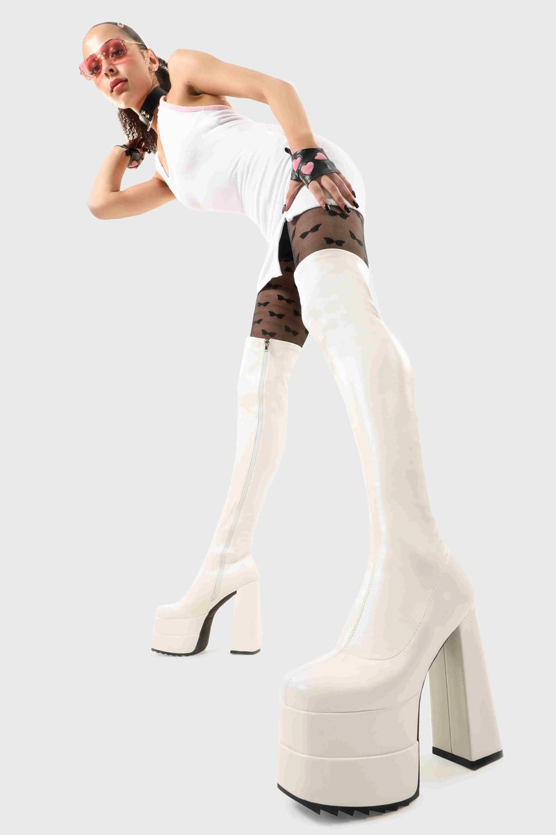 Ground Breaking
  
  Fantasies Platform Thigh High Boots in White Stretch faux leather. These platform boots feature on our double stack platform sole, leave them with a lasting impression. Made with eco-friendly materials and 100% cruelty-free, these platform boots are as ethical as they are Ground Breaking!
  
  - Platform Height
  - Heel Height
  - White Zip 
  - Thigh high length
  - Shark's teeth grip
  - Chunky Platform sole
  - Round Toe 
  - 100% vegan 
  
  SKU: LMF 2698 - WhitePU