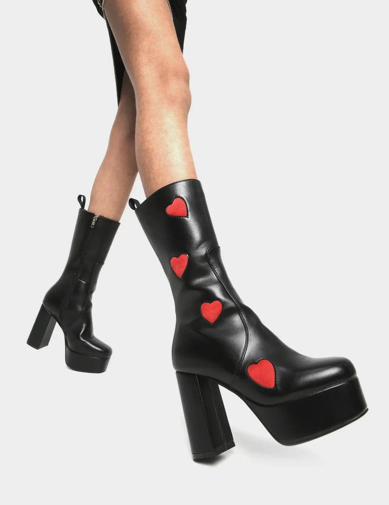LOVE AT FIRST SIGHT

Game Of Love Platform Calf Boots in Black faux leather. These Black vegan Boots feature our ICONIC Red faux suede hearts and Platform sole and heel, perfect for adding height and style to any outfit. Made with eco-friendly materials and 100% cruelty-free, these boots are as ethical as they are cute!


- Platform Height: 1.25 inch
- Heel Height: 4.2 inch
- Calf High length
- Red Hearts
- Black zipper 
- Platform sole
- Round Toe
- 100% vegan 

SKU: LMF 1213 - BlackPU/RedHeart