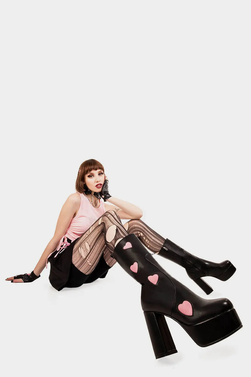 LOVE AT FIRST SIGHT

Game Of Love Platform Calf Boots in Black faux leather. These Black vegan Boots feature our ICONIC Pink faux suede hearts and Platform sole and heel, perfect for adding height and style to any outfit. Made with eco-friendly materials and 100% cruelty-free, these boots are as ethical as they are cute!


- Platform Height: 1.25 inch
- Heel Height: 4.2 inch
- Calf High length
- Pink Hearts
- Black zipper 
- Platform sole
- Round Toe
- 100% vegan 

SKU: LMF 1213 - BlackPU/PinkHeart