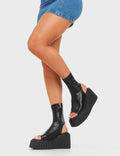 RE-ELEVATED
  
  Games Of Luck Chunky Platform Creeper Ankle Boots in Black faux leather. These sandals feature a minimalist design with a open toe design on a ankle length platform boot. Made with eco-friendly materials and 100% cruelty-free, these platform boots are as ethical as they are Charming.
  
  - Platform Height
  - Heel Height
  - Black Zip
  - Ankle Length
  - Open Toe
  - Chunky Platform Creeper Sole
  - Round Toe
  - 100% Vegan
  
  SKU: LMF 4529 - BlackPU