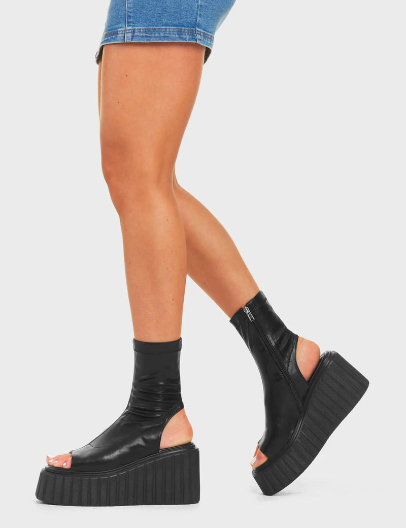 RE-ELEVATED
  
  Games Of Luck Chunky Platform Creeper Ankle Boots in Black faux leather. These sandals feature a minimalist design with a open toe design on a ankle length platform boot. Made with eco-friendly materials and 100% cruelty-free, these platform boots are as ethical as they are Charming.
  
  - Platform Height
  - Heel Height
  - Black Zip
  - Ankle Length
  - Open Toe
  - Chunky Platform Creeper Sole
  - Round Toe
  - 100% Vegan
  
  SKU: LMF 4529 - BlackPU